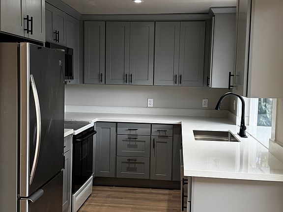 Renovated kitchen with new contemporary cabinets