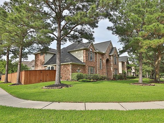 An attractive corner lot that shines with towering, mature trees and a recently installed fence with high end finish!