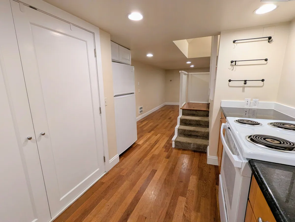 Kitchen with entry stairs - 1205 E Olive St #C