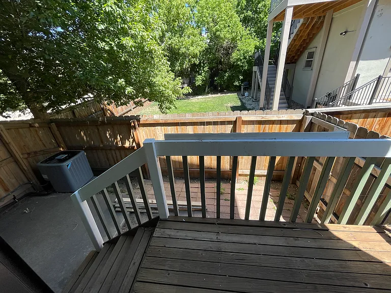 Back deck leading to private fenced patio area