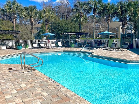 A sparkling resort-style pool invites endless summer days and carefree moments.