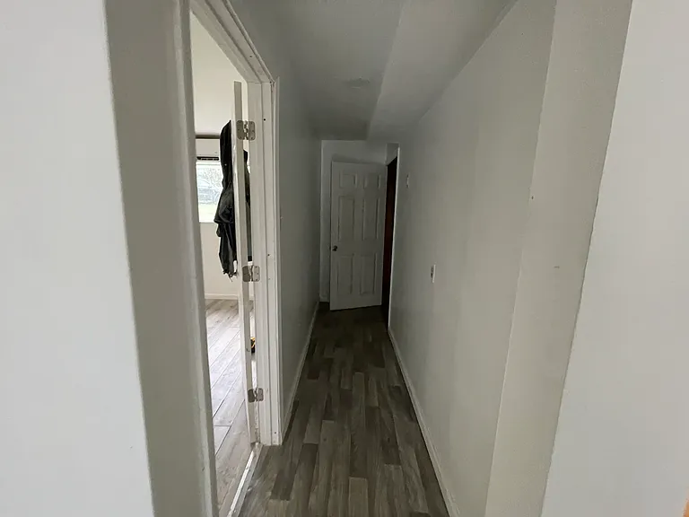 Hallway to lead to master bedroom and basement
