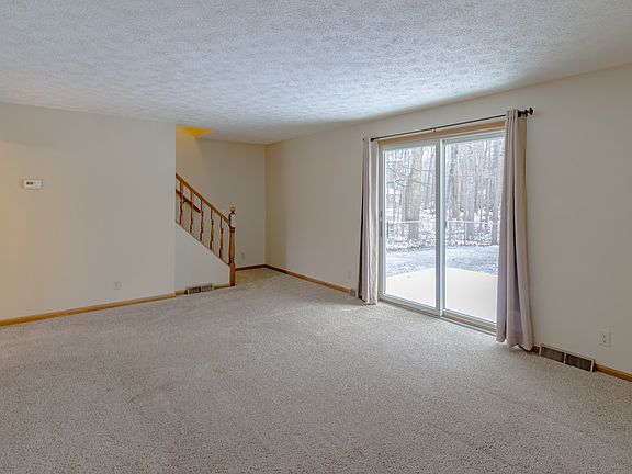 Here is the large living room. Nice sliding door to go out to the fenced in back yard. Also there is a deck off the slider to relax and enjoy the beautiful days.