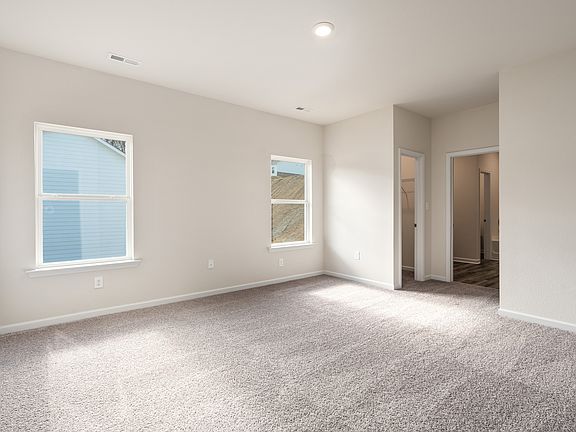 The gorgeous master suite is the perfect place to relax after a long day