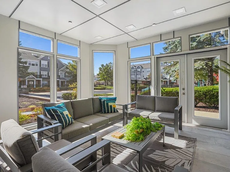 Relax and enjoy abundant natural light in this inviting community gathering space.