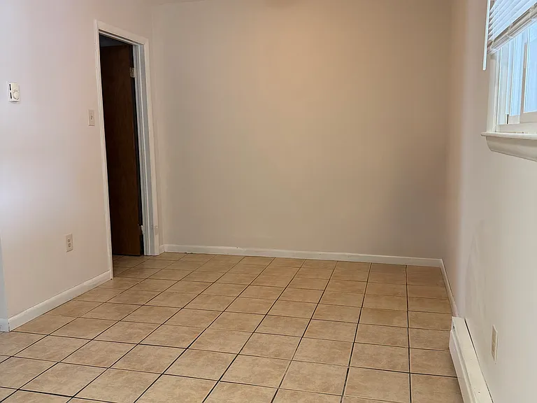 Dining room with a pantry/storage room.