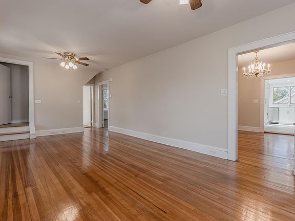 Living Room opens to the Formal Dining Room, Primary Bedroom.