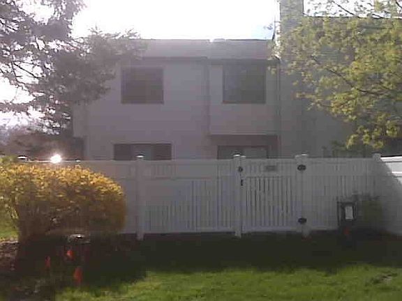 Back view with view of privacy fence