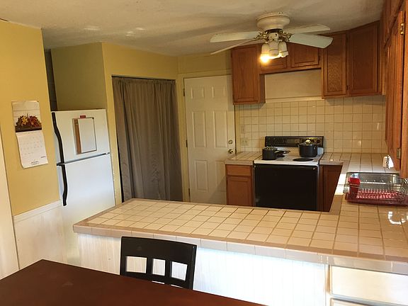 Laundry area is behind the curtains