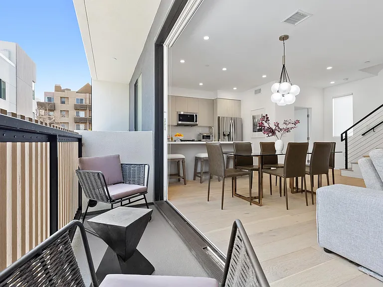 Balcony Space with comfortable seating and plenty of sunlight.