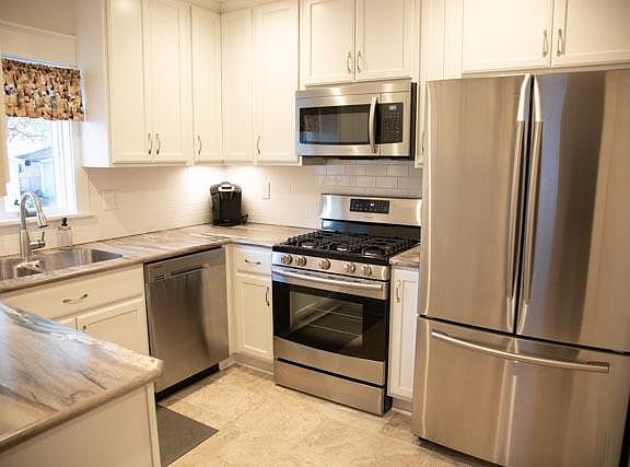 New Kitchen- with new cabinets, under cabinet lighting, countertops and stainless steel appliances