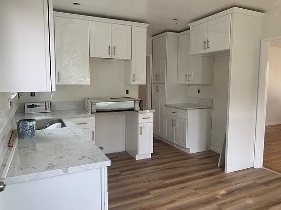 Brand new kitchen cabinets, counters, floors