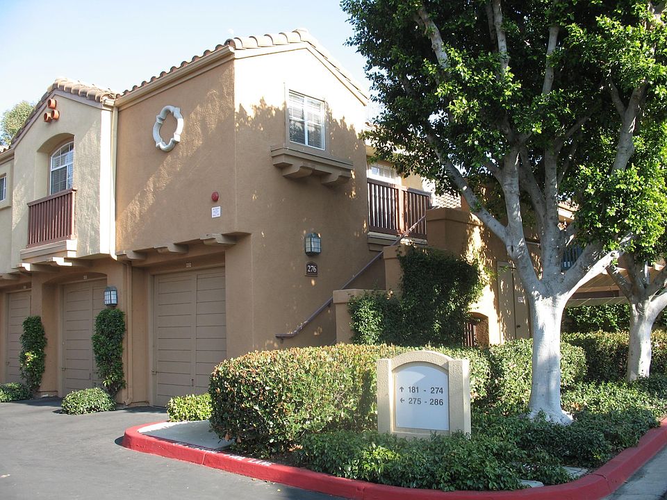 Exterior view of condo unit with garage underneith.