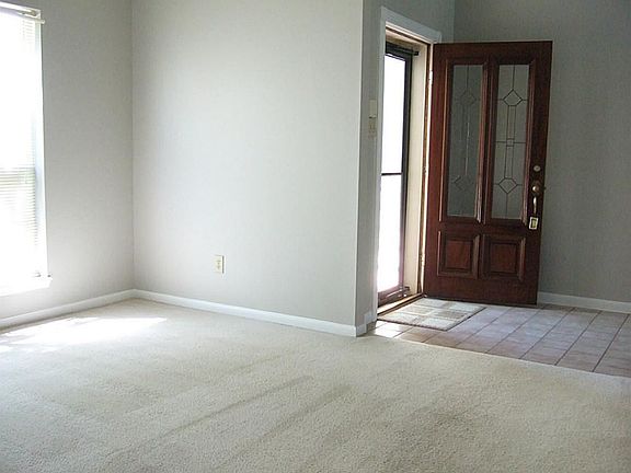FORMAL DINING OFF THE ENTRY; FRONT DOOR WITH GLASS INSERTS AND STORM DOOR