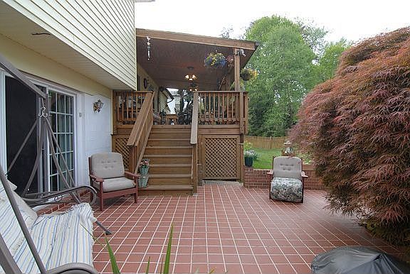 Brick Patio Shaded by Japanese Maple Tree