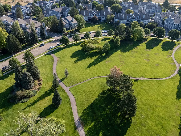 Extensive walking paths and open green space create a peaceful, park-like setting woven throughout the community.