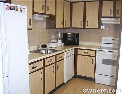 Kitchen with wood floors and clean appliances