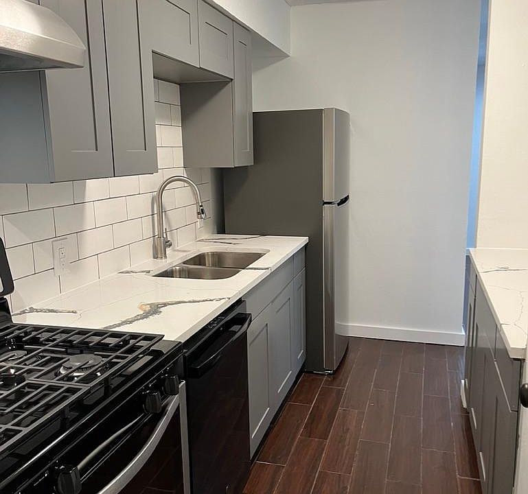 Galley kitchen tile that looks like wood on the floor