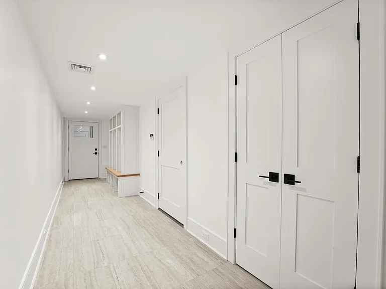 Finished LOWER LEVEL w/Mudroom, Main Laundry Area, Family Room, and Garage