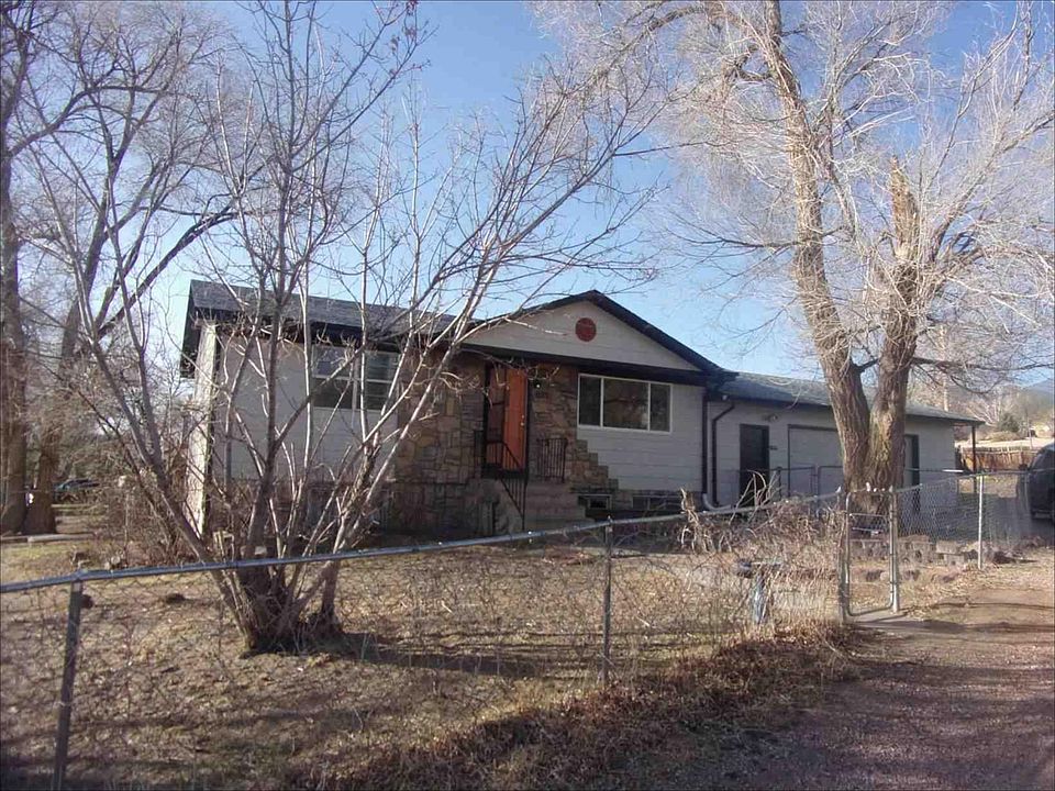 Home sweet home! Your dog will love this yard.