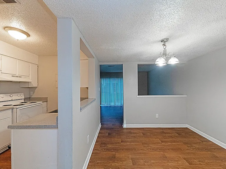 Dining area with hardwood-style flooring