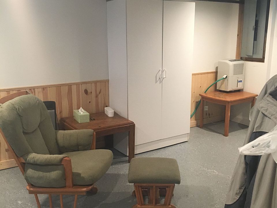 Finished seating area and workshop in basement.