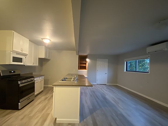 kitchen, dining, family area/reading nook (door to laundry and basement)