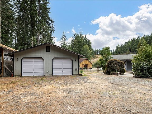 Garage/ shop  28/32   RV Carport next to garage.