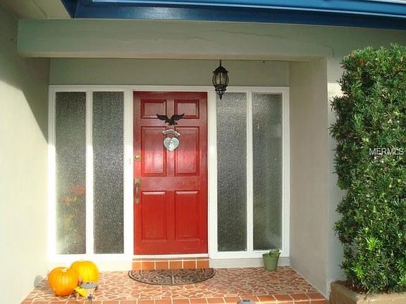 Delightful entry is covered - side windows bring light into the entry!