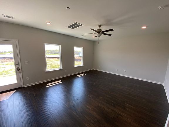 Wood floors throughout the family room, kitchen and dining areas.