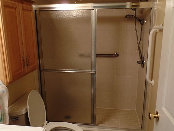 remodeled hall bath with walk in shower