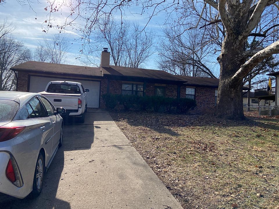 Front view of this ranch home. Deep, doublewide driveway leads to the 2 car garage.