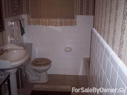Hall Bath
						:
						Tiled Walls and New tiled flooring.