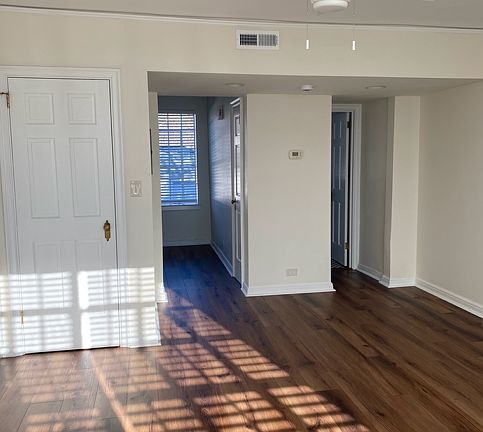 Facing the kitchen, left, and the bathroom, right.