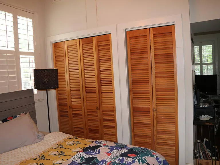 Bedroom. The stackable washer/dryer is in the smaller of these two closets. The bedroom has two sets of closets on the opposite side of the bedroom as well so there is lots of closet space.
