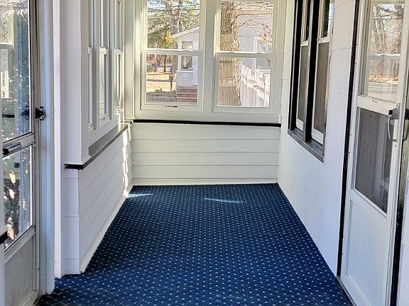 Enclosed front porch.