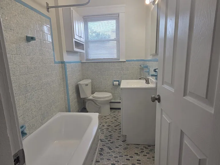 Bathroom entrance on the left