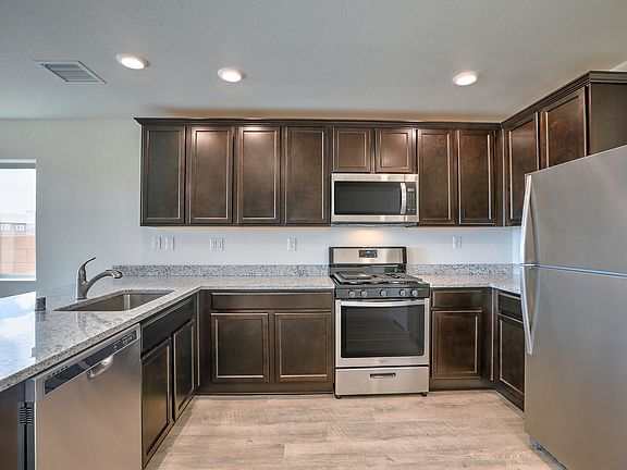 Stunning kitchen with stainless appliances.