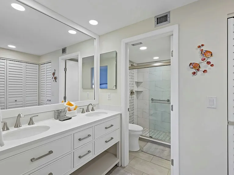 Newly Renovated primary bathroom with dual his-and-hers vanities