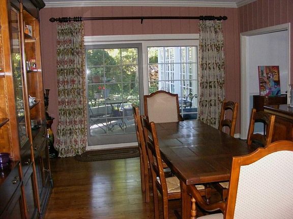Dining room opens to slate terrace and has its own fireplace. Room is 19x13.  
