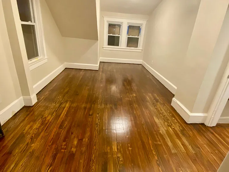 (second floor) right top bedroom with lots of windows, led lights, hardwood floors, wall to wall closets, large size bedroom. 10x17