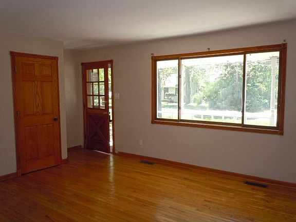 Living Room with Hardwood Floors and Windows for Excellent Lighting