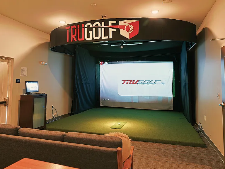 Rain or shine, tee time is always an option in the virtual golf room_just one of the unexpected perks at 32 Union.