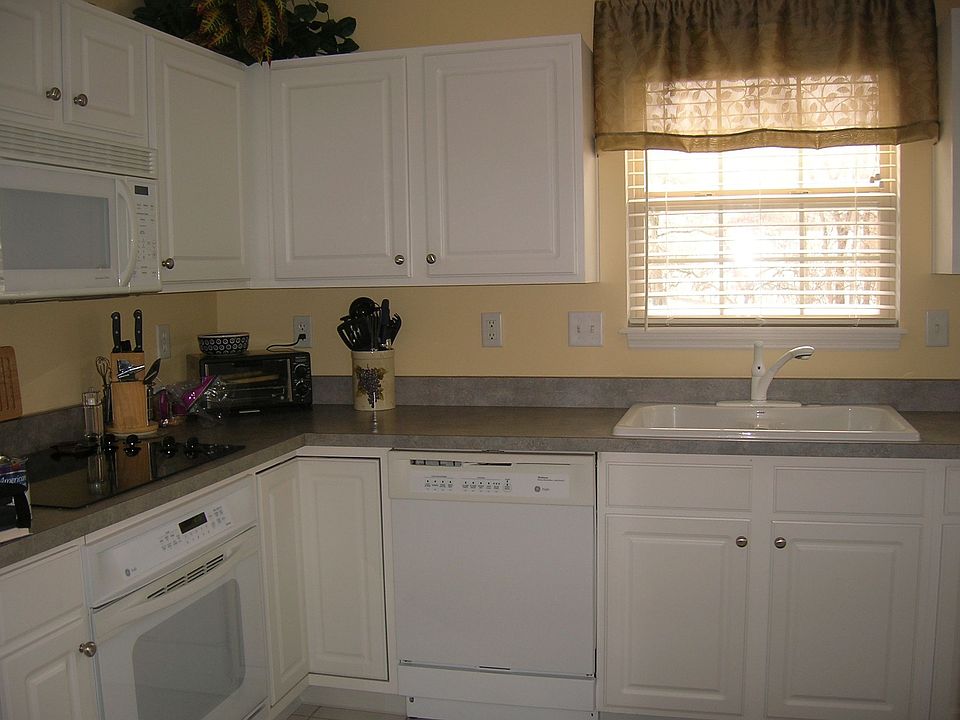 kitchen with convection oven, tile floor, and wood cabinets
