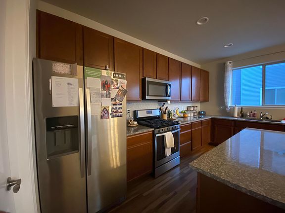 Large 36" refrigerator and gas range with microwave above