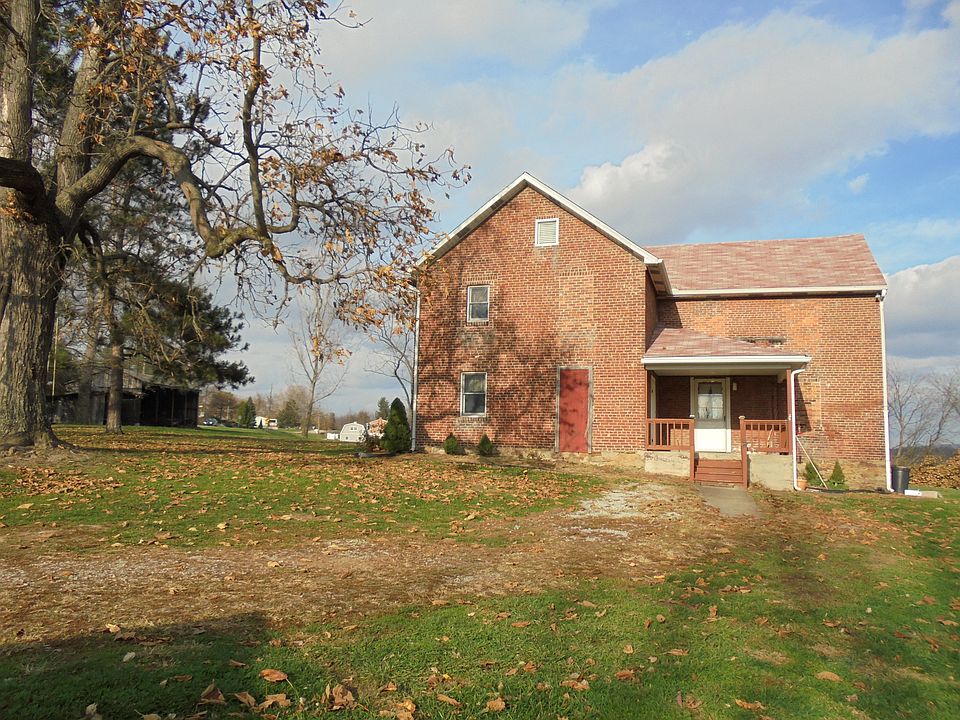 Front door on driveway side.