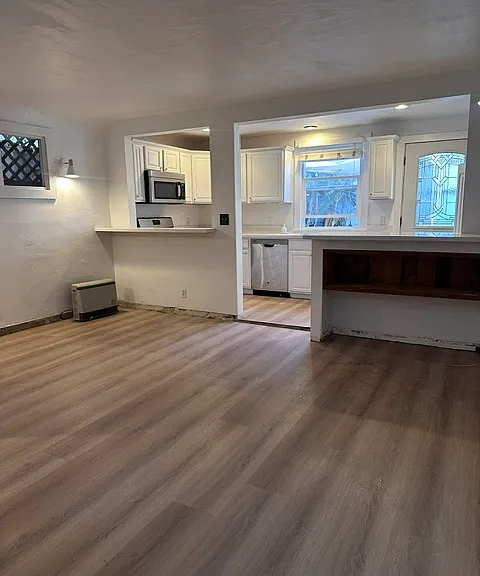 Living room with bar eating area