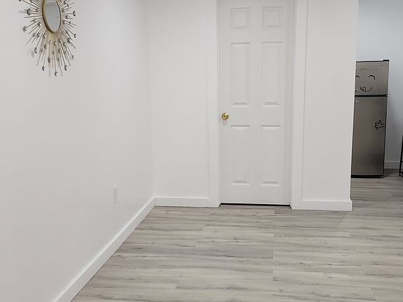 Living space and view of bathroom