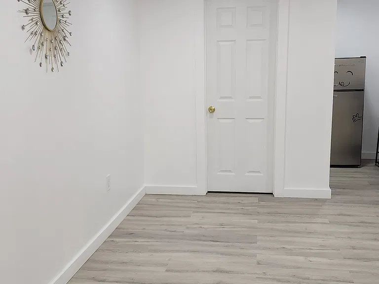Living space and view of bathroom