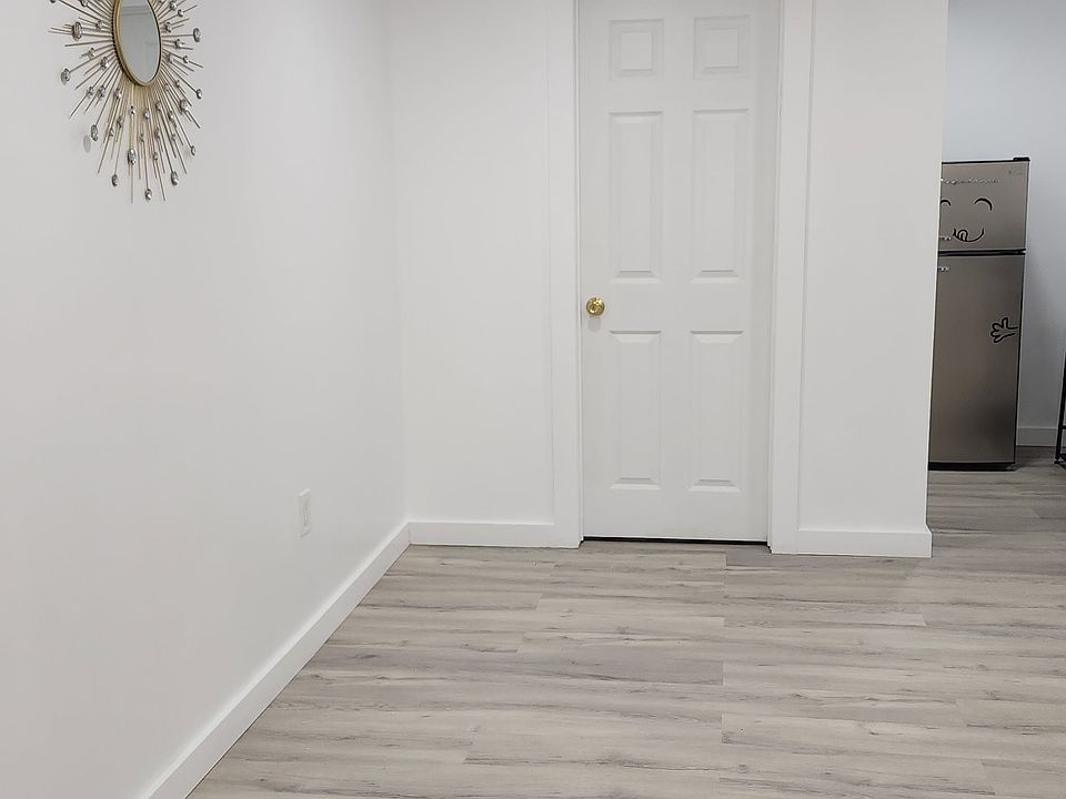 Living space and view of bathroom